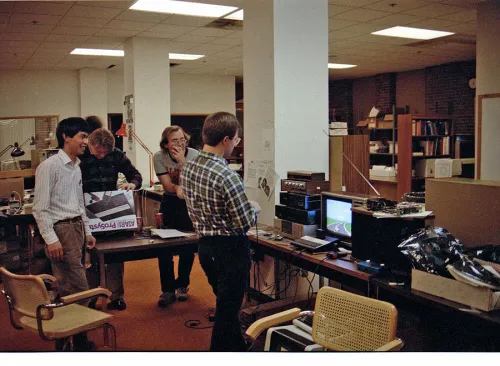 Playing some Pole Position II in the GCC office. Photo from former GCC employee Steve Szymanski&rsquo;s archive.
