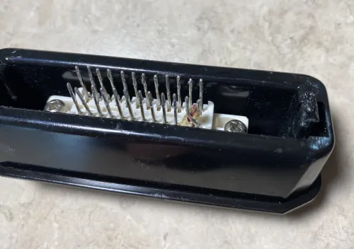 Photo of the Turkish-made Atari 2600's cartridge console port from above, looking down at the pins, showing that two pins have been physically reversed.