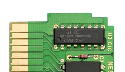 Public domain photo by @VanamoMedia depicting the CIC chip from a Tetris cartridge, sourced from the "CIC (Nintendo)" Wikipedia page. The caption provided at Wikipedia is: "This chip was required on games in order to play on an NES, so that unauthorized games would be locked out. This was done so Nintendo could prevent a flood of unauthorized software, while also requiring game publishers to purchase their cartridges through Nintendo."